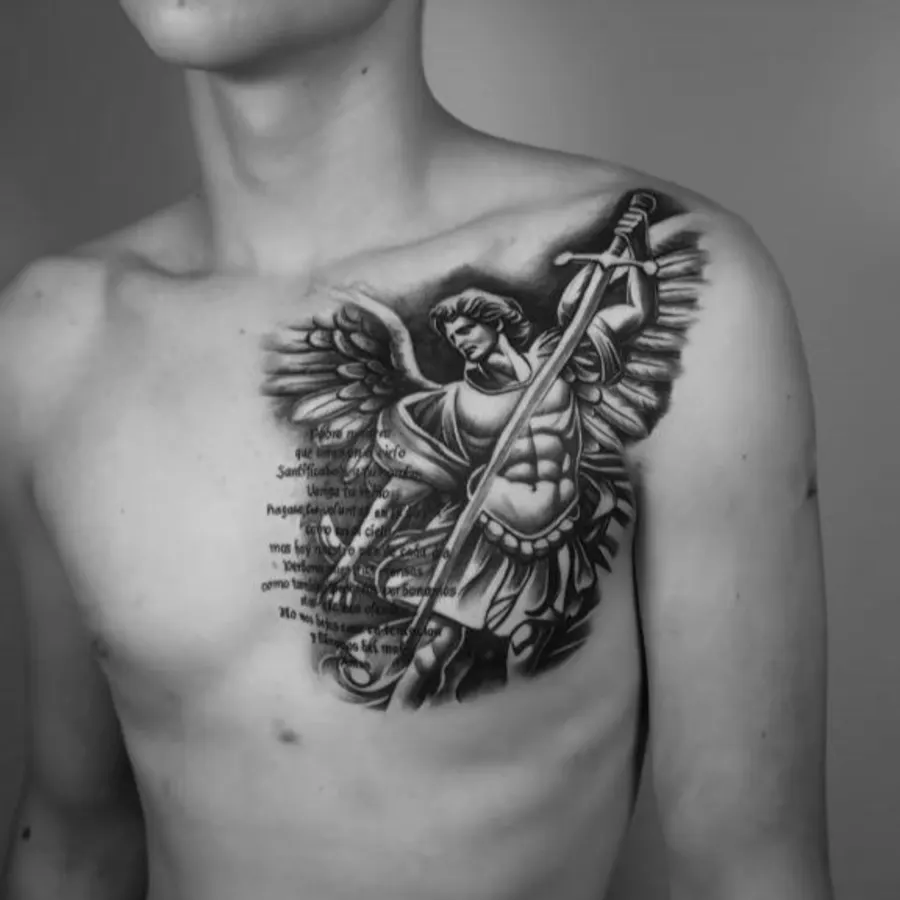 Black and grey Saint Michael archangel chest tattoo with script